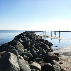 Scenic view of sea against clear blue sky