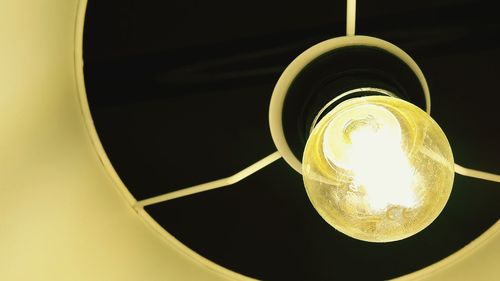 Low angle view of illuminated light bulb