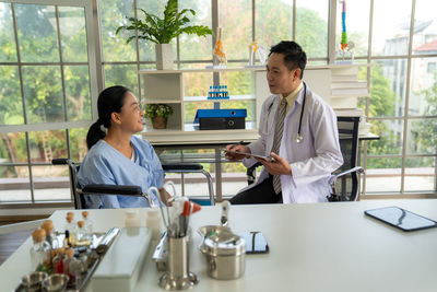 Female doctor working in office