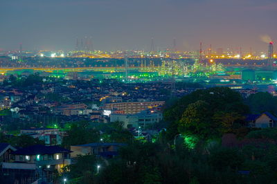 High angle view of illuminated buildings in city at night