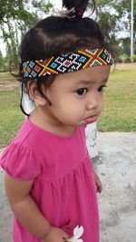 Close-up of cute girl looking away