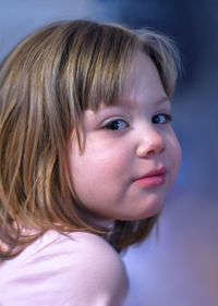 Portrait of a beautiful little girl in pink