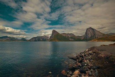 Scenic view of lake and mountains against sky