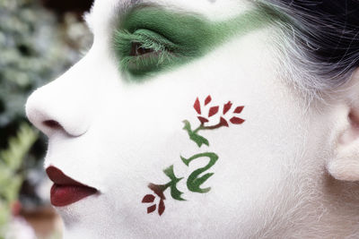 Close-up of girl with face paint