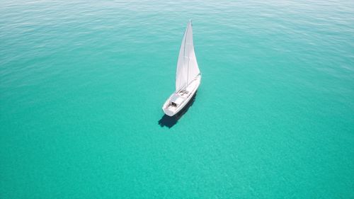 High angle view of sailboat sailing in sea