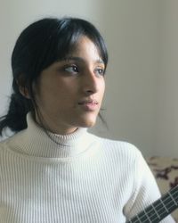 Close-up portrait of a young indian/middle eastern woman.