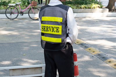 Rear view of man standing on street