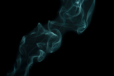 Close-up of smoke against black background