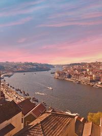 High angle view of townscape by sea against sky