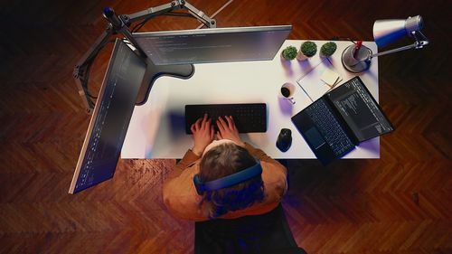 High angle view of woman using digital tablet