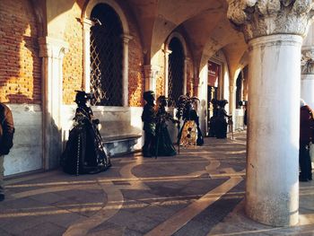 People on walkway during venice carnival