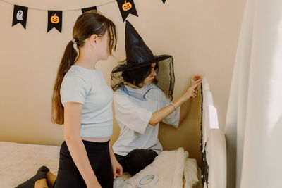 Portrait of young woman sitting on staircase