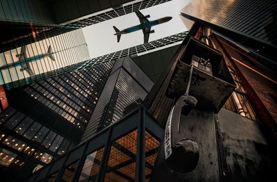 Low angle view of man on staircase against building