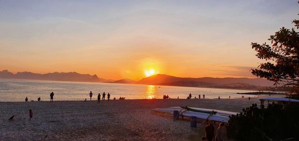 Scenic view of beach against sky during sunset