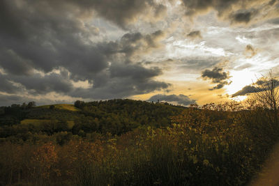 Scenic view of dramatic sky over landscape