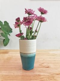 Close-up of potted flowering plants on table