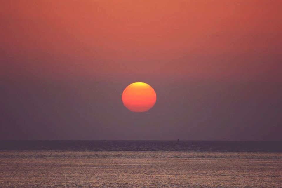 scenics, tranquil scene, sunset, sea, tranquility, horizon over water, beauty in nature, orange color, water, copy space, idyllic, sun, nature, waterfront, sky, clear sky, moon, no people, red, outdoors