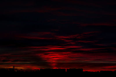 Scenic view of dramatic sky at sunset