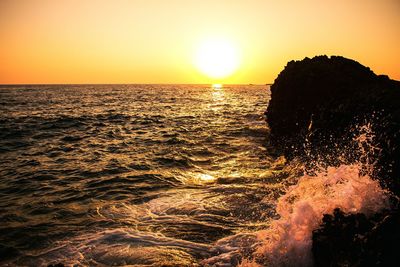 Scenic view of sea at sunset