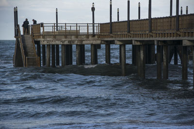 Pier over sea against sky