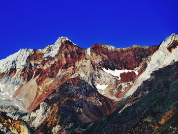 Rocky mountain against blue sky