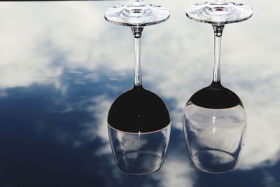 Reflection of glasses on table