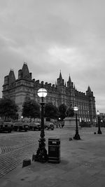 Buildings against cloudy sky