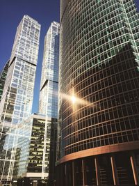 Low angle view of modern buildings against sky in city