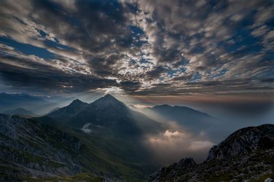 Scenic view of mountains against sky during sunset