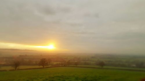 Scenic view of landscape at sunset