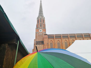 Low angle view of multi colored building against sky
