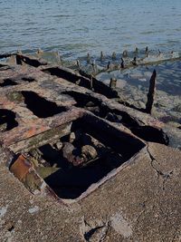 High angle view of old rusty at beach