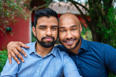 Portrait of smiling gay couple