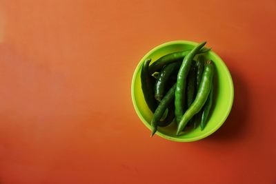 High angle view of green chili pepper on table