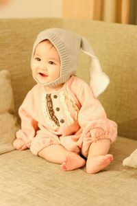 Cute baby girl sitting on floor