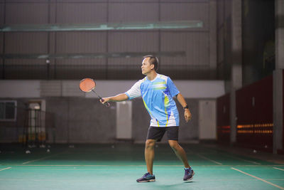 Full length of man playing with ball