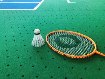 High angle view of ball on green court 