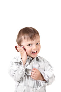 Portrait of boy drinking against white background