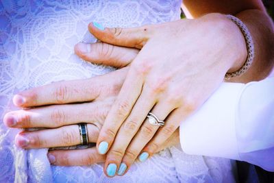 Close-up of couple holding hands