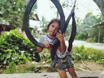 Full length of cute girl standing outdoors