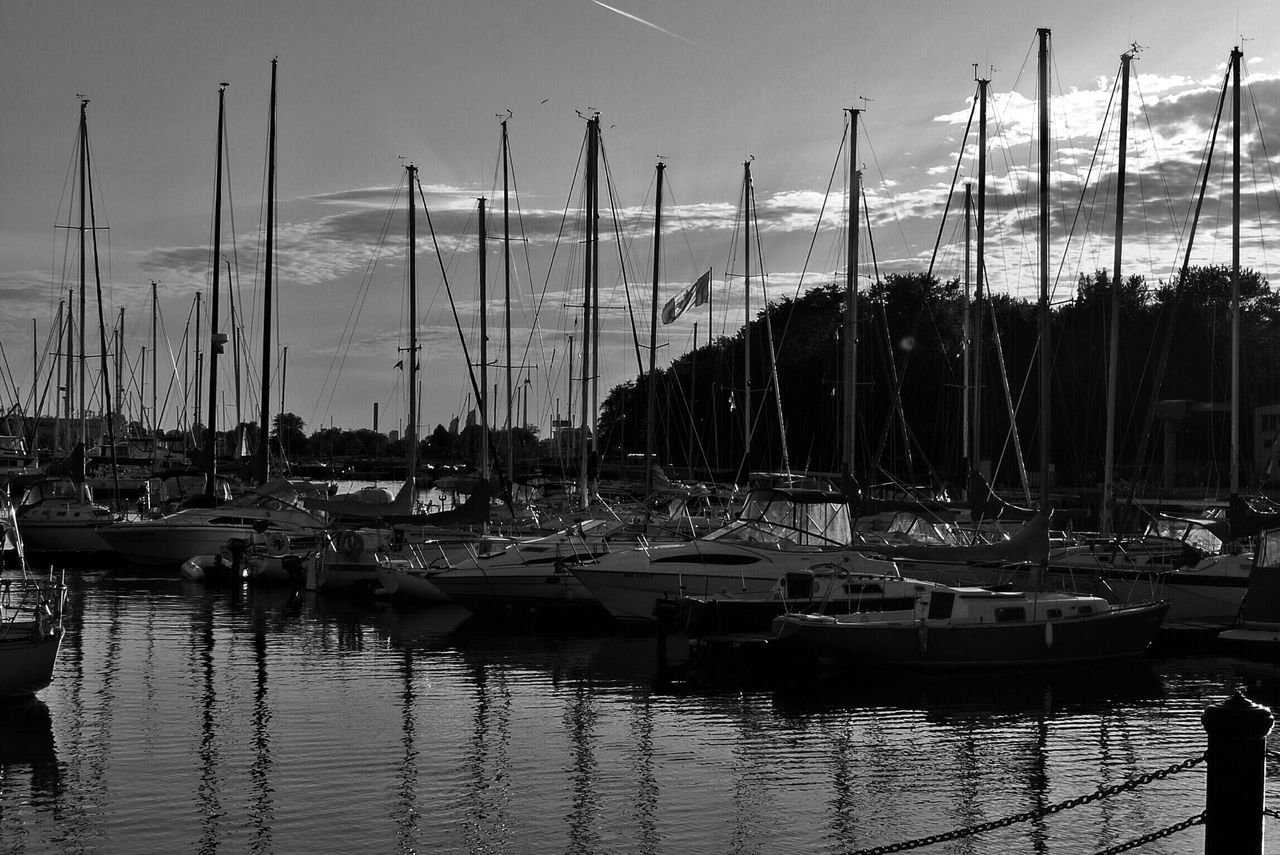 nautical vessel, moored, water, transportation, boat, mast, mode of transport, sailboat, harbor, sea, sky, reflection, marina, in a row, waterfront, travel, nature, tranquility, outdoors, lake