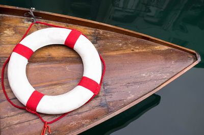 Life belt on boat moored at harbor