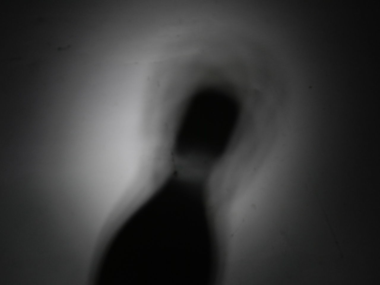 CLOSE-UP OF A BLURRED MOTION OF WOMAN IN BACKGROUND