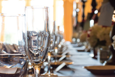 Close-up of drinking glasses on table