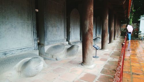 Rear view of man walking in temple