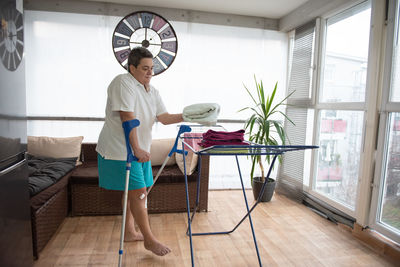 A disabled person washes laundry.