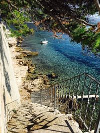 High angle view of footpath by sea