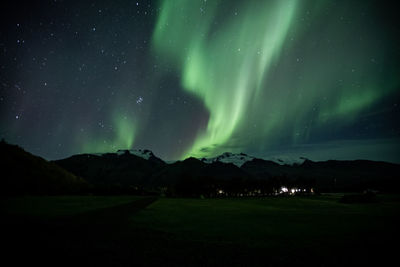 Aurora borealis, also known as northern lights, over Öræfajökull mountain, at skaftafell, iceland.