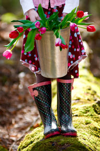 Low section of man standing on plant