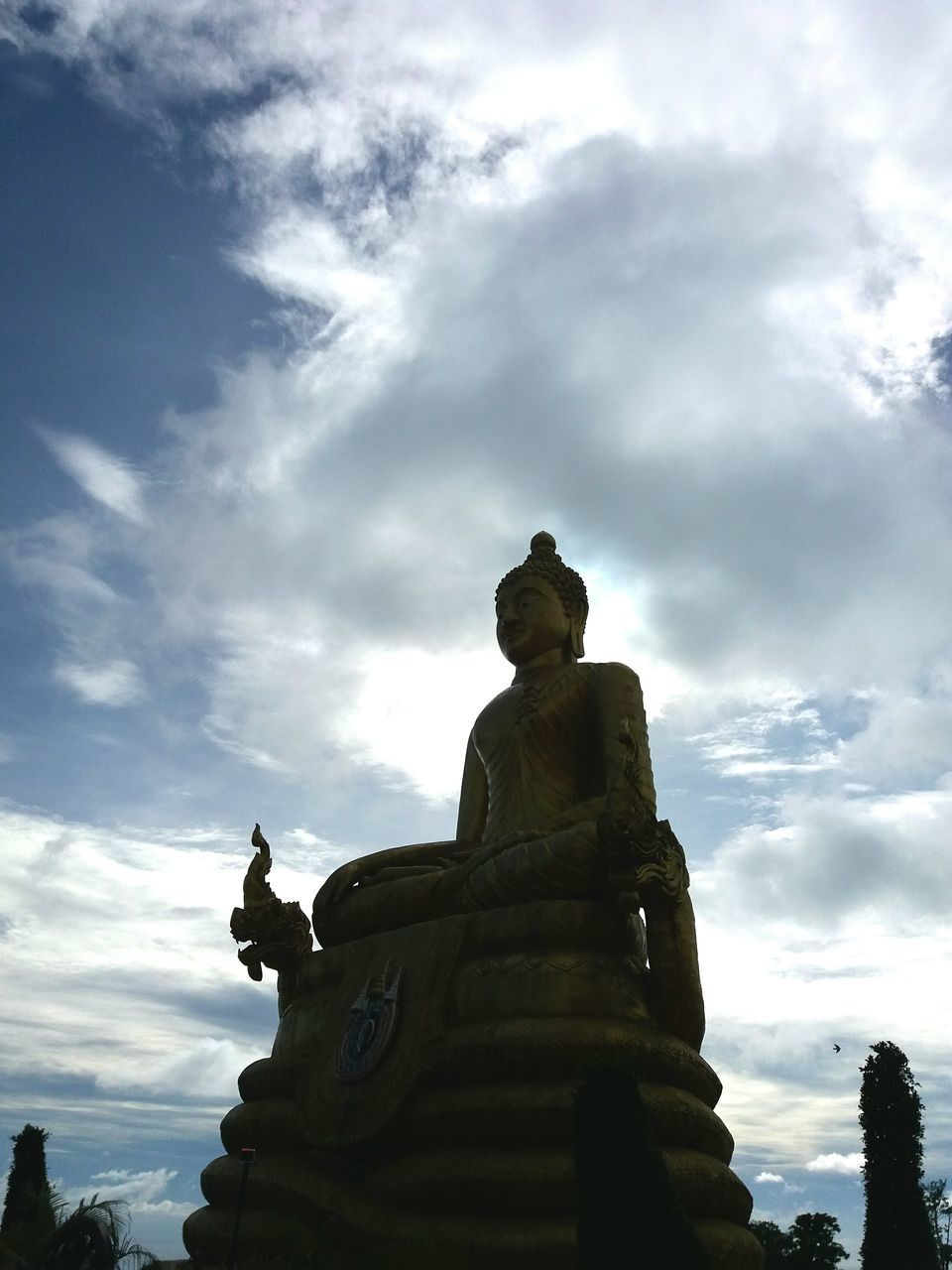 statue, cloud - sky, human representation, sky, religion, travel destinations, architecture, sculpture, no people, outdoors, spirituality, building exterior, idol, day